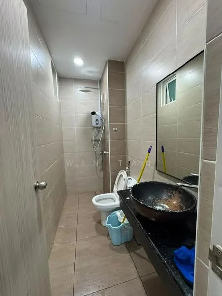 Bathroom features: ceramic tile flooring, beige tiled walls, shower with glass partition, wall-mounted shower head, toilet, single-sink vanity with black countertop, mirror above sink, water heater, cleaning supplies, bucket, blue cloth; style: modern.