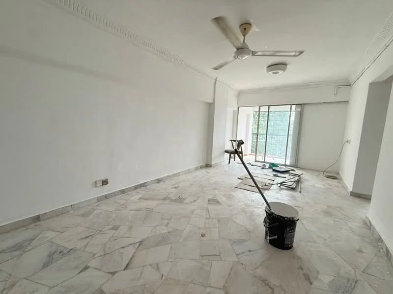 Living features: white painted walls, marble flooring, 5-blade ceiling fan, sliding glass door, floor-to-ceiling windows, natural light, crown moulding, unfinished space with construction materials.