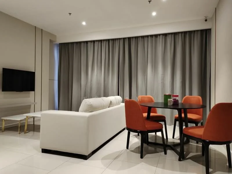 Living features: white fabric sofa, 4-seater round dining table, orange upholstered dining chairs, flat-screen TV mounted on wall, grey curtains, recessed downlights, glossy white tile flooring, minimalist decor; style: modern.