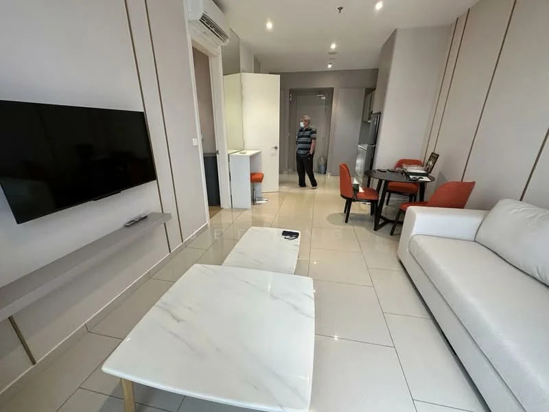 Living features: white leather sofa, marble coffee table, wall-mounted TV, dining table with four orange chairs, refrigerator, kitchen cabinetry, tile flooring, air conditioning unit, neutral painted walls, light fixtures, open layout; style: modern.