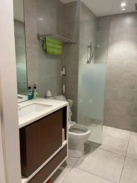 Bathroom features: single-sink vanity with wood cabinet, chrome basin mixer faucet, framed mirror, one-piece toilet, walk-in shower with glass enclosure, rain shower head, tile cladding on walls, ceramic tile flooring, recessed downlights, towel rack, green towel, soap dispenser, toiletries on vanity; style: modern.