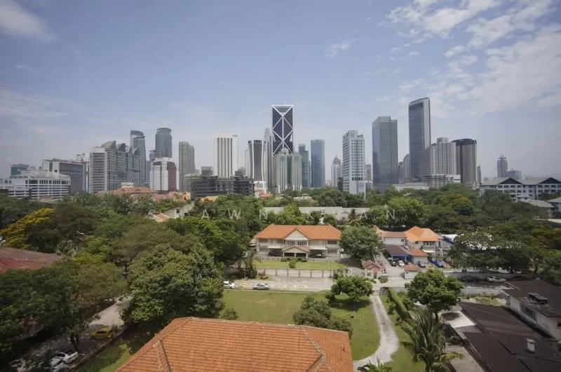 Exterior type: high-rise condominium; features: city skyline view, surrounded by mature greenery, mixed residential and commercial buildings, modern architecture, rooftop gardens, various building heights, clear blue sky, urban landscape; style: modern.