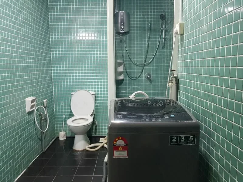 Bathroom features: green tiled walls, black tile flooring, one-piece toilet, shower with handheld showerhead, washing machine, water heater, sink with faucet, towel rack; style: modern.
