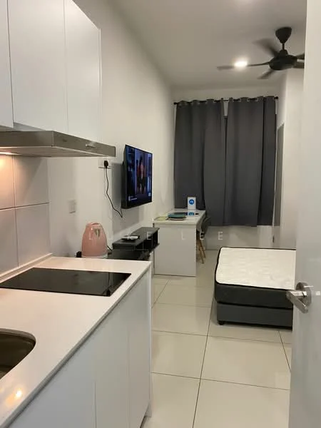 Room features: white cabinetry, black countertop, stainless-steel sink, built-in induction cooktop, wall-mounted TV, grey curtains, ceiling fan, white tiled flooring, mattress on bed frame, small study desk, chair, kettle; style: modern.