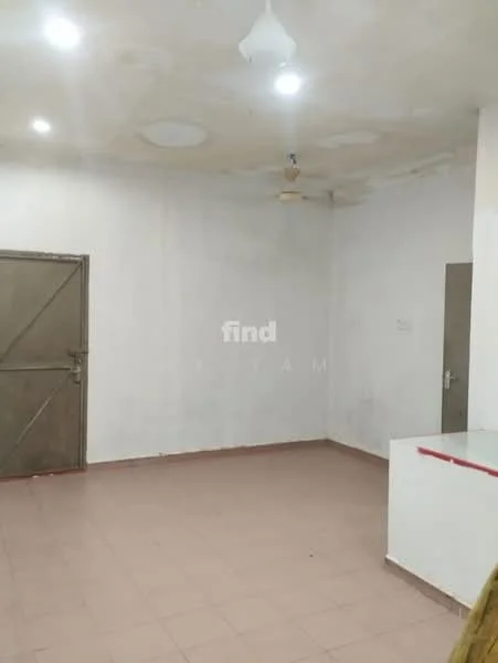 Room features: white painted walls, plain ceiling with circular light fixtures, floor tiles in beige, single ceiling fan, metal door, empty space with no furniture, no visible windows, corner with a small counter or partition; style: minimalist.