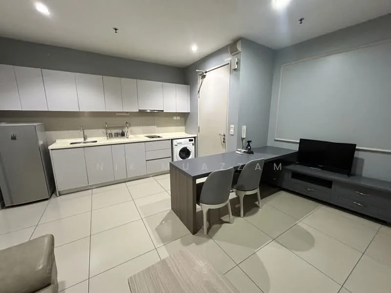 Kitchen features: white cabinetry, stainless-steel fridge, double-bowl stainless-steel sink, chrome pull-down faucet, built-in washing machine, ceramic tile flooring, light grey walls, countertop with backsplash, dining table with two chairs, wall-mounted TV, grey TV console; style: modern.