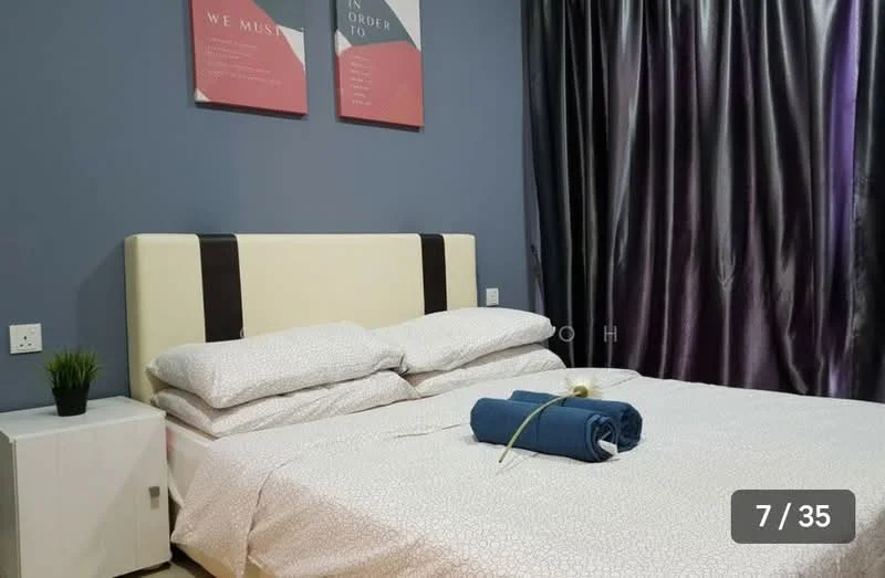 Bedroom features: queen-size bed, upholstered headboard, white bedding with patterned duvet, decorative throw blanket, nightstand with drawer, table lamp on nightstand, green potted plant, grey accent wall, dark curtains, framed wall art; style: modern.