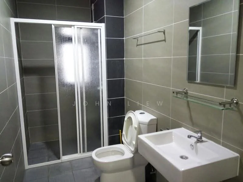 Bathroom features: glass shower enclosure, walk-in shower with sliding door, white ceramic sink, chrome basin mixer faucet, one-piece toilet, framed mirror, wall-mounted glass shelf, grey ceramic tile flooring, light grey wall tiles, dark grey accent wall tiles; style: modern.