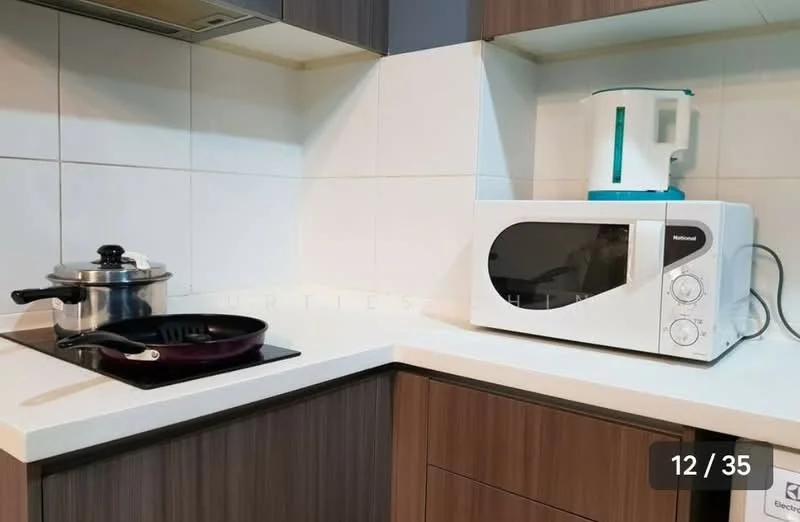 Kitchen features: laminate cabinetry in brown, white quartz countertop, stainless-steel sink, built-in stove with gas burner, microwave oven in white, kettle in white, stainless-steel pot, non-stick frying pan, white tiled backsplash, under-cabinet lighting; style: modern.