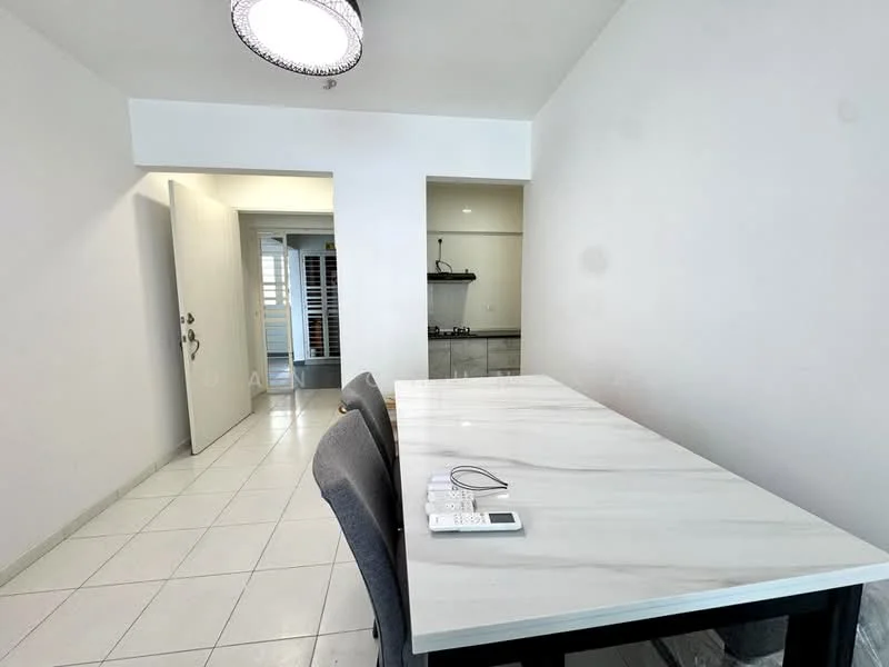 Room features: white painted walls, marble dining table, grey upholstered chairs, tile flooring, ceiling light fixture, open doorway leading to another room, kitchen area visible in the background; style: modern.