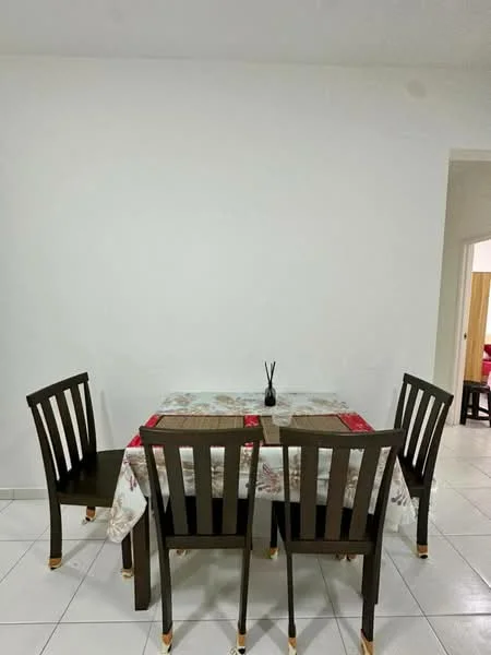 Dining features: white painted walls, white tiled flooring, wooden dining table, 4 wooden dining chairs, tablecloth with floral pattern, decorative vase on table, neutral color scheme; style: modern.