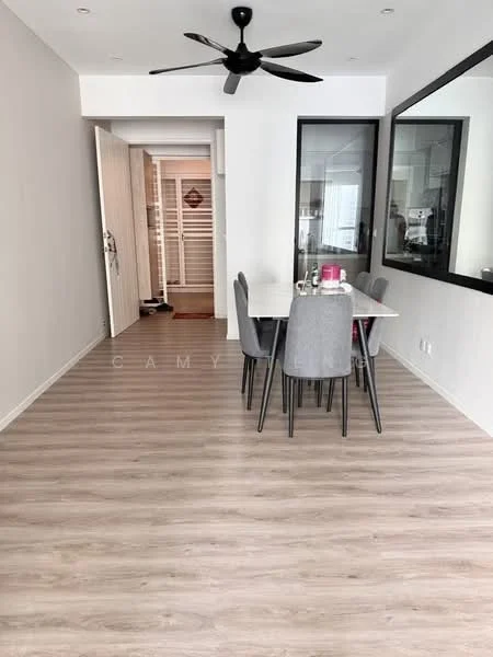 Dining features: light wood laminate flooring, white walls, 5-blade ceiling fan, dining table for 6, upholstered dining chairs in grey, large wall mirror, natural light from window, decorative centerpiece on table; style: modern. Room features: white painted walls, doorway leading to hallway, light wood laminate flooring.
