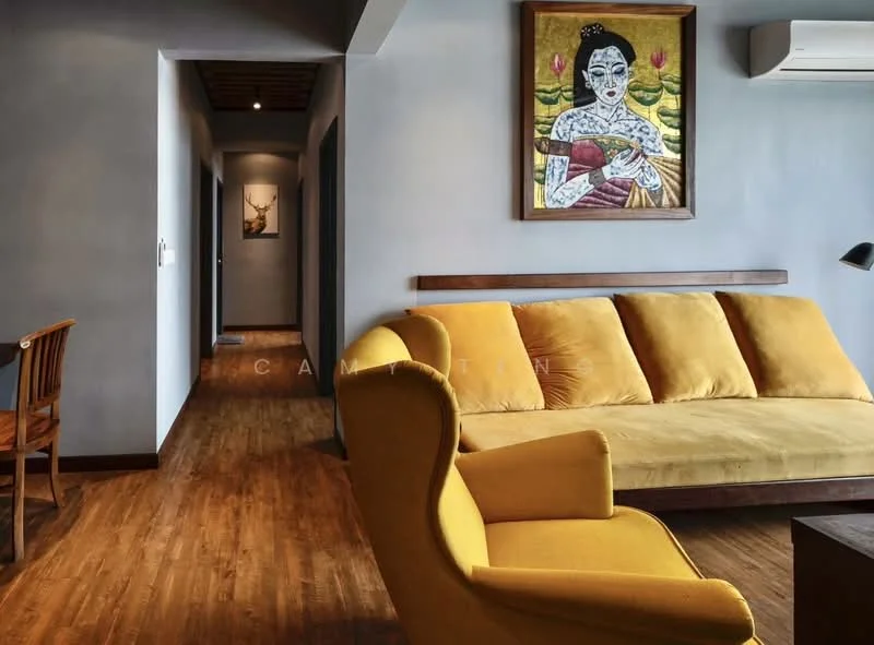 Living features: yellow fabric sofa, wooden coffee table, wooden dining chair, wooden flooring, grey painted walls, artwork on wall, air conditioning unit, recessed lighting, decorative wall art; style: modern. Hallway features: grey painted walls, wooden flooring, doorways leading to other rooms.
