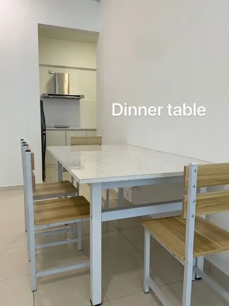 Dining features: white rectangular dining table with marble top, 4 wooden dining chairs with light wood finish, kitchen area visible in background, white walls, cream tiled flooring, refrigerator visible in kitchen, built-in kitchen cabinetry, stainless-steel appliances; style: modern.