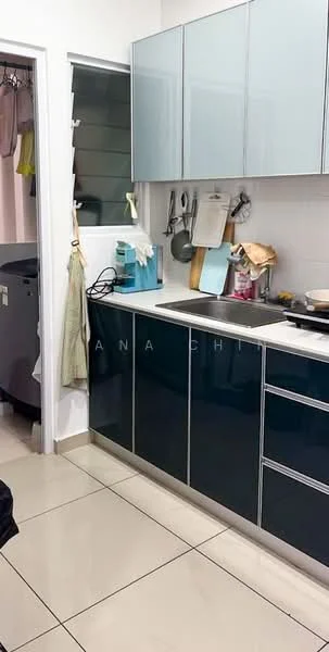 Kitchen features: blue cabinetry with glossy finish, white countertop, single-bowl stainless-steel sink, chrome pull-down faucet, built-in stove, kitchen utensils hanging on wall, appliances visible including a kettle, tile flooring, wall-mounted cabinet, open shelving, window above sink, laundry area visible in background; style: modern.