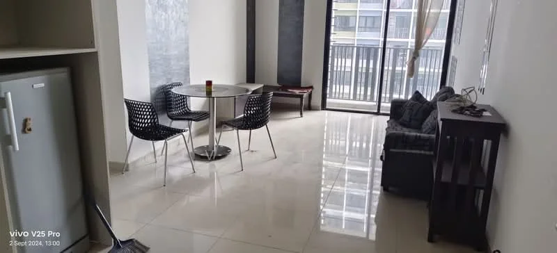 Living features: white painted walls, glossy tile flooring, floor-to-ceiling windows, sliding glass door, black leather sofa, round dining table, 4 black dining chairs, wooden console table, decorative items on console, curtains, light fixture; style: modern; view: city.