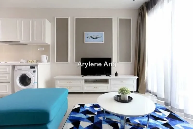 Living features: light grey walls, white cabinetry, white TV console, black wall-mounted TV, blue fabric sofa, round coffee table, area rug with geometric pattern, large floor-to-ceiling windows with sheer curtains, washing machine, decorative plant on coffee table; style: modern.