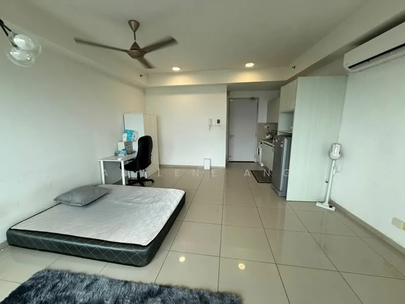 Room features: white painted walls, glossy tile flooring, ceiling fan, wall-mounted air conditioning unit, kitchenette with cabinets, stainless-steel fridge, built-in countertop, desk with chair, mattress on the floor, door leading to hallway, light fixture, area rug; style: modern.