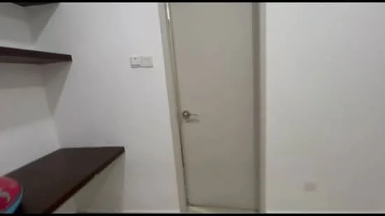 Room features: white painted walls, wooden shelf, plain door, light-colored flooring.