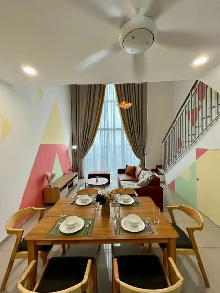 Dining features: wooden dining table, 4 wooden dining chairs, white dinner plates, green placemats, decorative vase with flowers, pendant light fixture, 5-blade ceiling fan, grey curtains, accent wall with geometric patterns, sofa in maroon, wall-mounted TV console, floor-to-ceiling windows; style: modern.