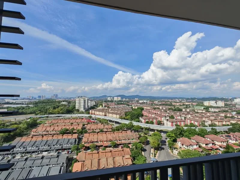 Exterior type: high-rise condominium; features: city skyline view, surrounded by residential buildings, greenery in the foreground, clear blue sky, clouds, urban landscape, multi-storey buildings, road visible in the foreground; style: modern.