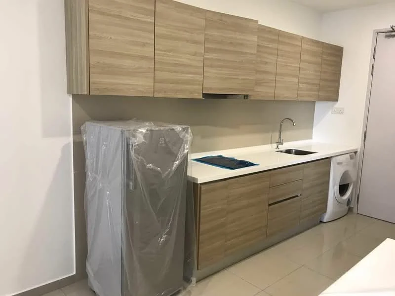 Kitchen features: light wood cabinetry, white countertop, single-bowl stainless-steel sink, chrome pull-down faucet, stainless-steel fridge wrapped in plastic, front-load washing machine, ceramic tile flooring, white painted walls; style: modern.