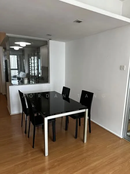 Dining features: black glass dining table, 4 black dining chairs, laminate flooring, white painted walls, recessed ceiling lights, large window with city view, open layout to kitchen, minimalist decor; style: modern; view: city.