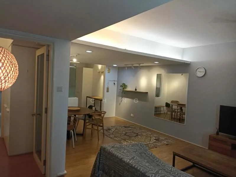 Living features: wooden flooring, grey painted walls, recessed downlights, wall-mounted TV, coffee table, area rug with geometric pattern, decorative mirror, ceiling fan, clock on wall, sofa, open layout to dining area; style: modern. Dining features: dining table, wooden dining chairs, light fixture above table, open layout to living area; style: modern.