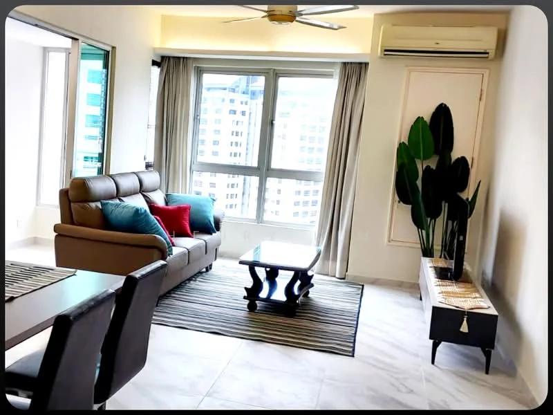 Living features: 3-seater leather sofa in brown, 2 accent pillows in blue and red, coffee table with dark wood finish, area rug with striped pattern, wall-mounted air conditioning unit, floor-to-ceiling windows, curtains in light fabric, decorative plant in pot, side console table with decorative items, ceiling fan with light; style: modern; view: city.