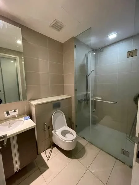 Bathroom features: single-sink vanity with cabinet, framed mirror, one-piece toilet, walk-in shower with glass enclosure, chrome basin mixer, tile cladding, recessed downlights, ceramic tile flooring, wall-mounted shower head, grab bar, built-in shelving; style: modern.
