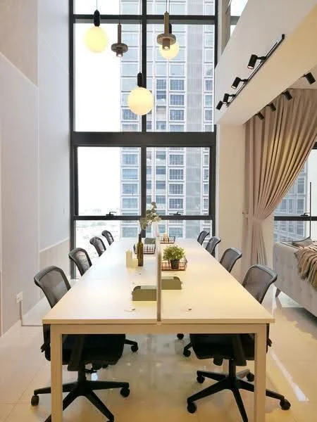 Room features: large windows with city view, white walls, polished tile flooring, modern pendant lighting, multiple office desks, ergonomic office chairs, decorative plants on desks, curtains, track lighting; style: modern; view: city.