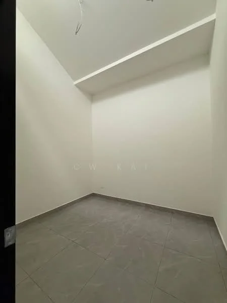 Room features: white painted walls, grey tile flooring, sloped ceiling, no visible windows, minimal decor.