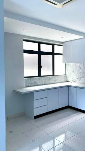 Kitchen features: light blue cabinetry, white marble countertop, white tiled backsplash, single-bowl stainless-steel sink, chrome pull-down faucet, built-in cabinets, under-cabinet lighting, window with black frame, white walls, recessed ceiling lights, ceramic tile flooring; style: modern.