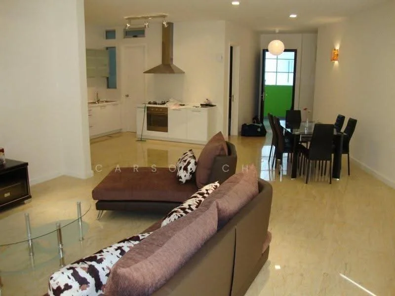 Living features: 3-seater fabric sofa in brown, accent chair with cow print, glass coffee table, wall-mounted TV, recessed downlights, cream painted walls, marble tile flooring, open layout to kitchen and dining area; style: modern. Kitchen features: white cabinetry, stainless-steel range hood, built-in oven, 4-burner gas hob, glass backsplash, marble countertop, open layout to living area; style: modern. Dining features: 6-seater dining table, black dining chairs, pendant lighting, cream painted walls, marble tile flooring; style: modern.