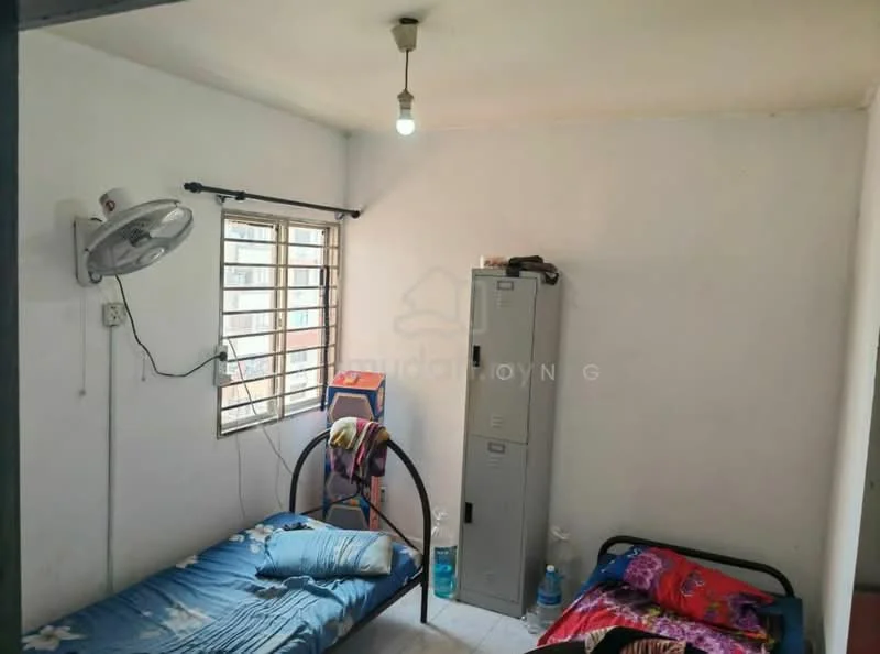 Bedroom features: white painted walls, tile flooring, single bed with blue bedding, single bed with pink bedding, wall-mounted ceiling fan, window with metal grille, metal storage cabinet, light bulb fixture.