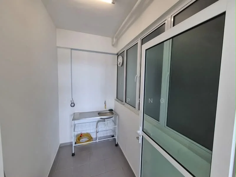 Laundry features: white walls, grey tile flooring, single-bowl stainless-steel sink, metal work table, floor-to-ceiling windows, clock on wall, sliding glass door, exposed ceiling, cable management, hose reel.