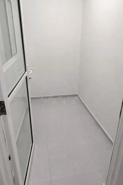 Room features: white painted walls, grey tile flooring, glass door, white door frame, corner room, natural light from window.