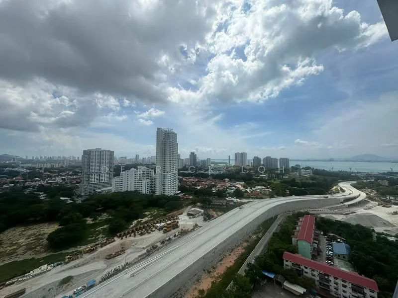 Exterior type: high-rise condominium; features: city skyline view, waterfront view, surrounded by greenery, construction site visible, high-rise buildings in the background, open sky with clouds; style: modern.