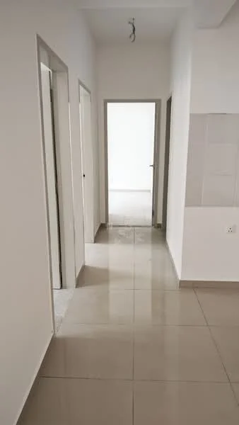 Room features: white painted walls, glossy beige floor tiles, recessed ceiling lights, multiple doorways, neutral color scheme, open layout, natural light from end of hallway; style: modern.