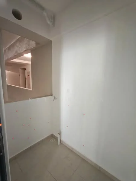 Room features: white painted walls, tile flooring, no visible windows, no visible doors, empty space.