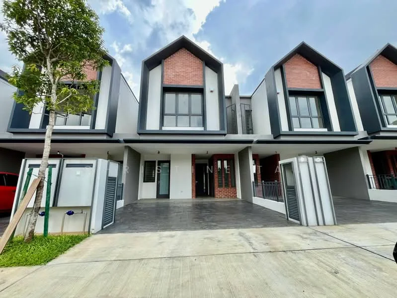 Exterior type: linked terrace house; features: grey painted facade, red brick accents, pitched roof, two-storey structure, manicured lawn, driveway with interlocking pavers, front porch, balconies on upper floor, large windows, security gate, visible car parking area; style: modern.