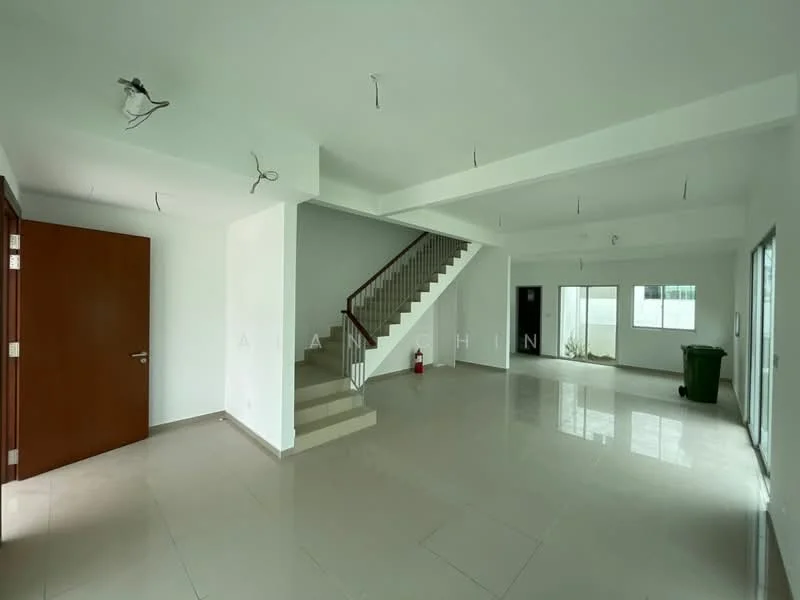 Room features: white painted walls, polished tile flooring, staircase with wooden railing, large windows for natural light, ceiling with exposed light fixtures, open layout, fire extinguisher visible, green trash bin, door leading outside; style: modern; view: garden.