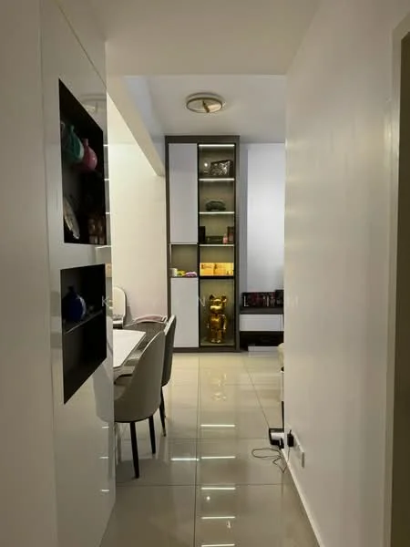 Room features: white painted walls, glossy tile flooring, recessed ceiling lights, built-in shelving unit with glass doors, decorative items on shelves, dining table with chairs, neutral color palette, open layout; style: modern.