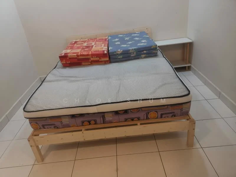 Bedroom features: single bed frame, mattress with patterned cover, stacked blankets with cartoon patterns, white painted walls, tile flooring, nightstand, minimalist decor; style: minimalist.