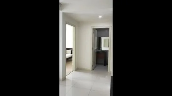 Room features: white painted walls, tile flooring, recessed downlights, doorway leading to another room, doorway leading to bathroom, neutral color scheme; style: modern.