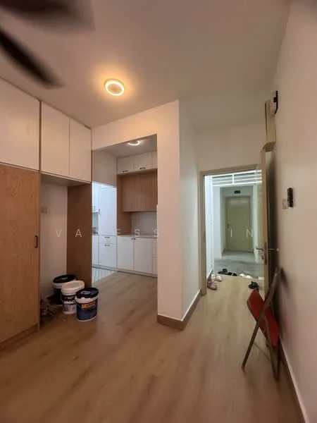 Room features: laminate flooring, white painted walls, ceiling light, built-in cabinets, open doorway, kitchen area with cabinets, buckets on the floor, chair, doorway leading to another room; style: modern.