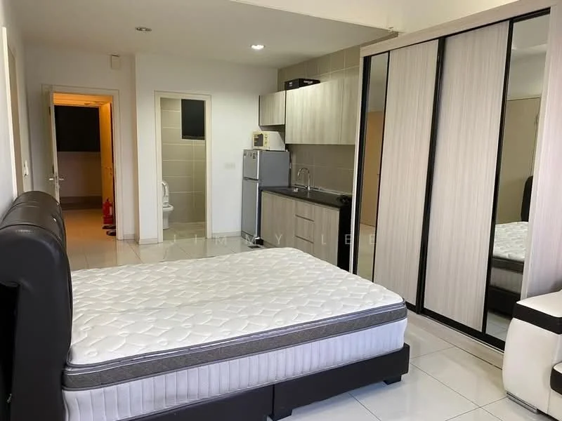 Bedroom features: queen-size bed, upholstered headboard, built-in wardrobe with sliding mirror doors, white walls, tile flooring, recessed downlights, kitchenette with cabinets, stainless-steel fridge, microwave, sink, countertop, bathroom door visible in background; style: modern.