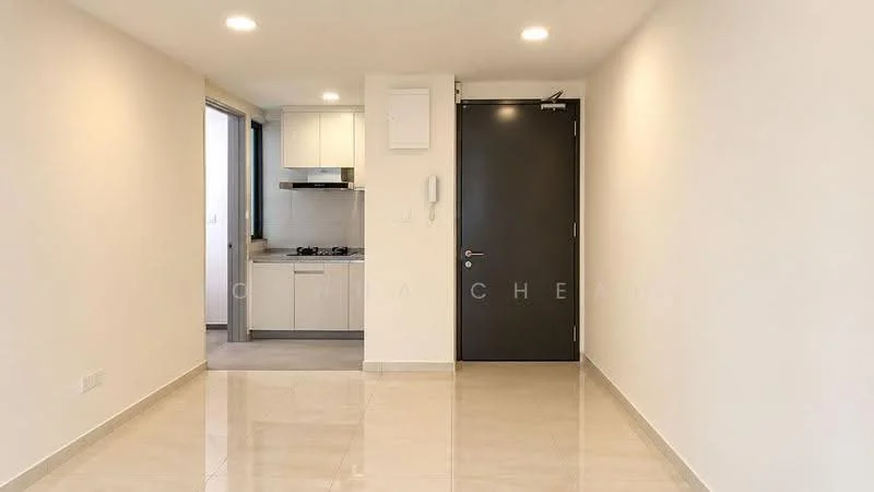 Room features: white painted walls, glossy tile flooring, recessed downlights, single door, open layout to kitchen, kitchen area visible, no visible furniture, neutral color scheme; style: modern.