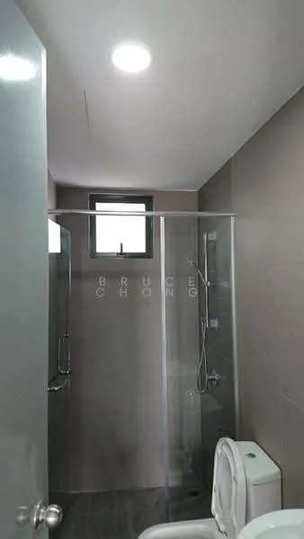 Bathroom features: glass shower enclosure, rain shower head, handheld shower, wall-mounted faucet, one-piece toilet, grey tiled walls, dark grey tiled flooring, window for natural light, recessed ceiling lights; style: modern.