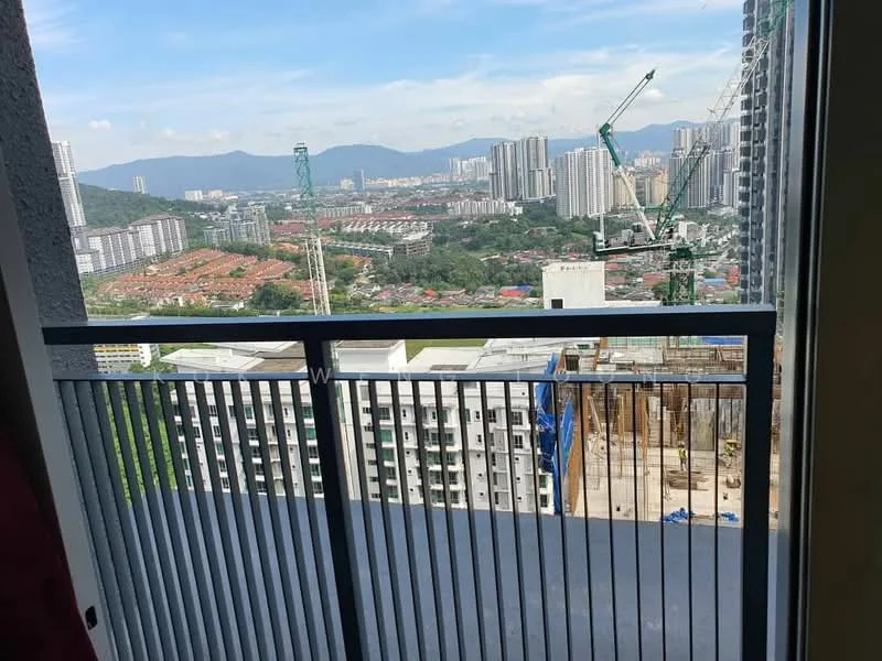 Balcony features: metal railing, concrete flooring, city view, mountain view, surrounding buildings, construction site visible; style: modern; view: city.